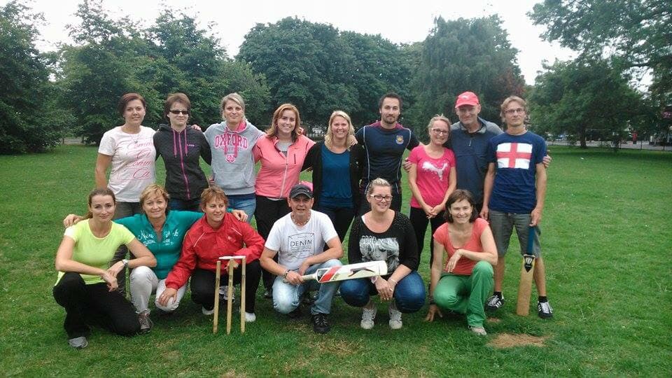 A group of students gathered to play cricket